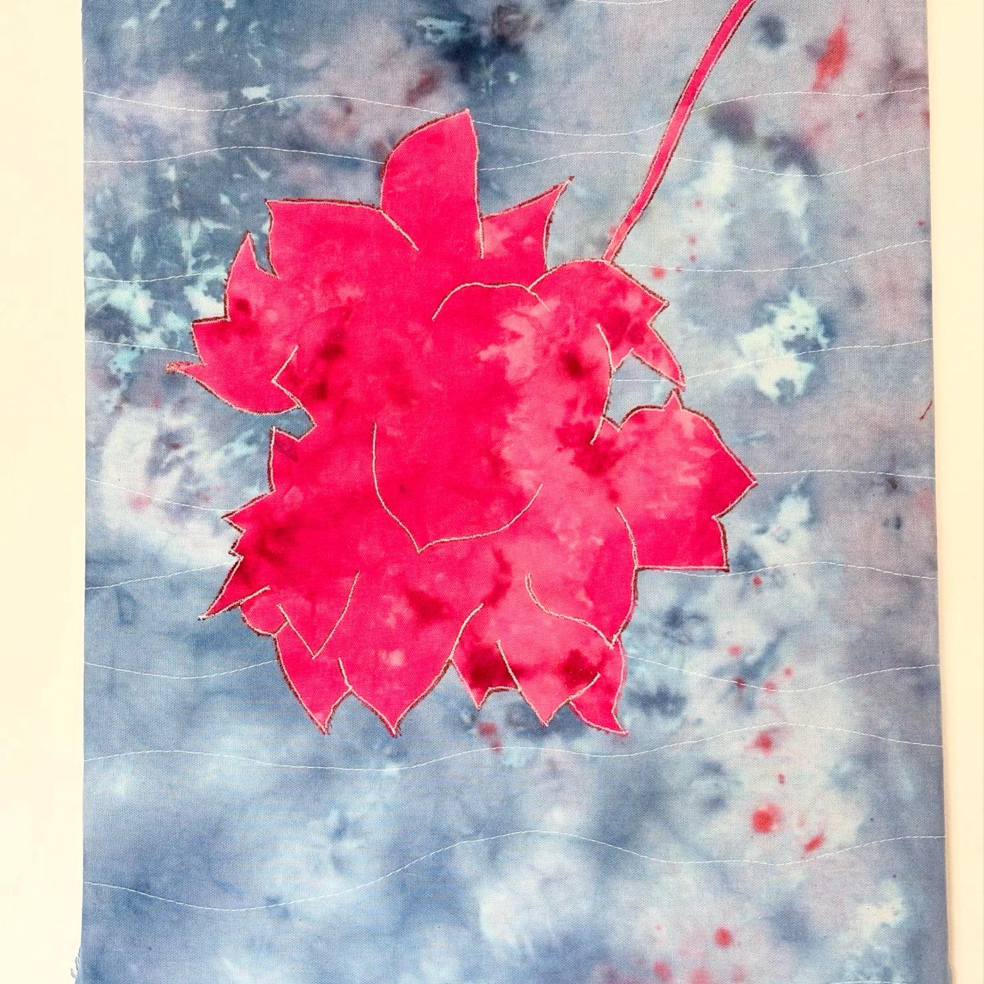 Fiber art with watercolor-style flower imagery