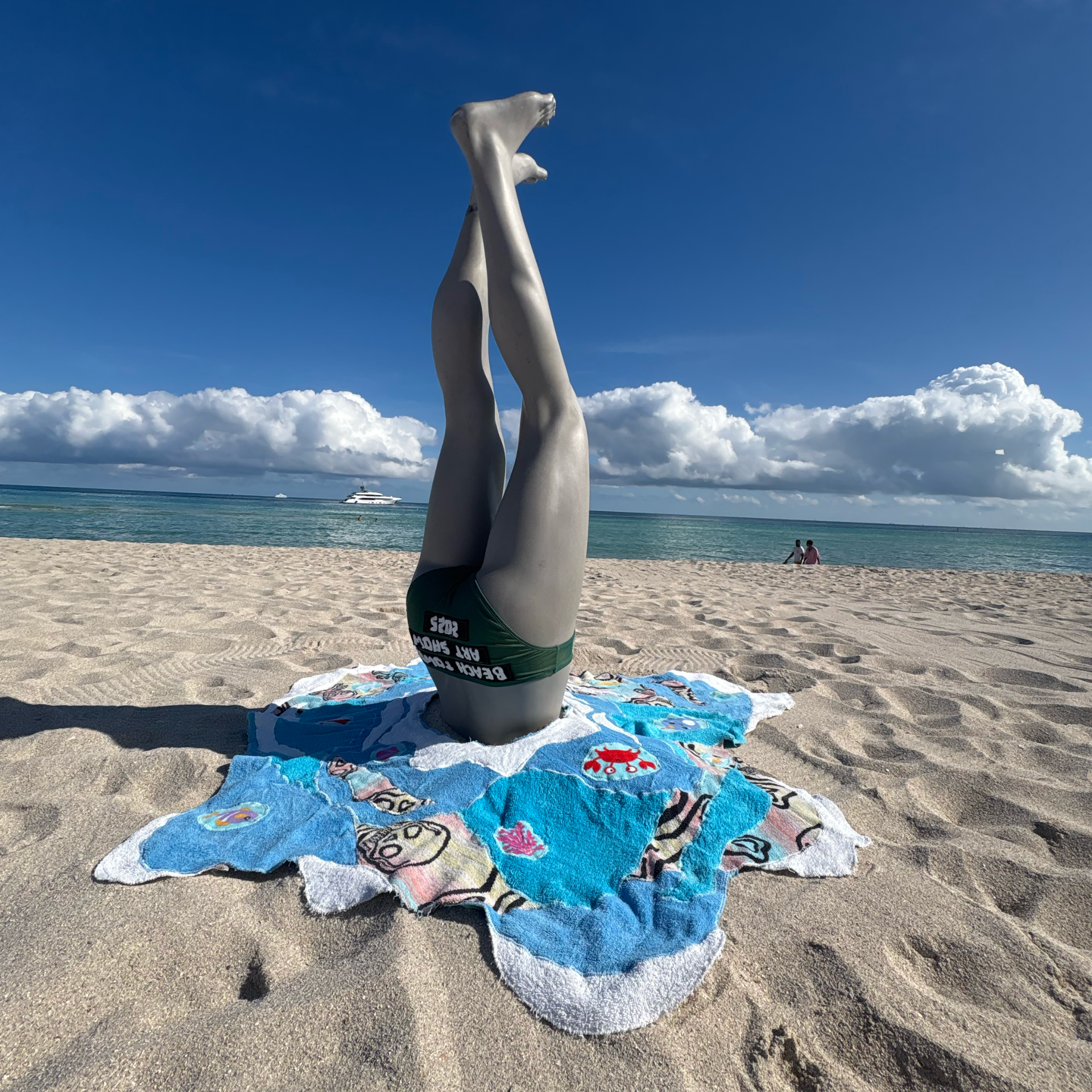 Fiber art showing underwater scene with figure in handstand